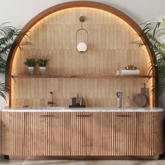 An arched niche in fluted timber and pale tile with a marble counter