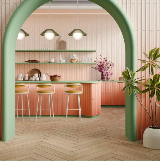 A retro kitchen through a green arch: fluted coral cabinets, mint shelves, herringbone floor