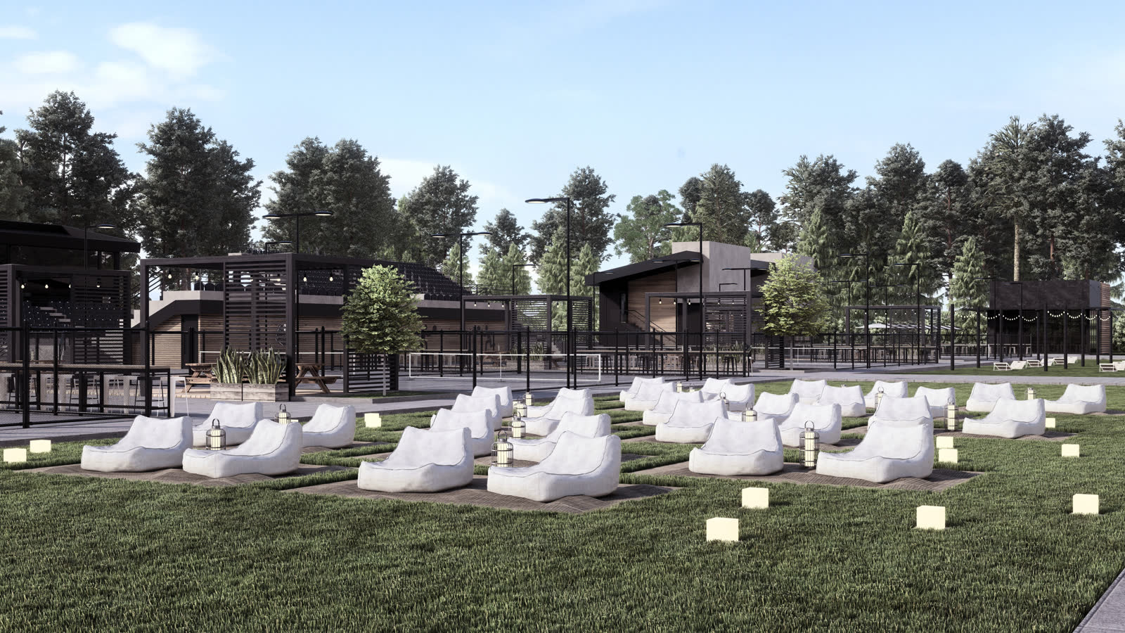 The lawn: white bean bags and lanterns on the grass, a black pergola with festoon lights, courts beyond