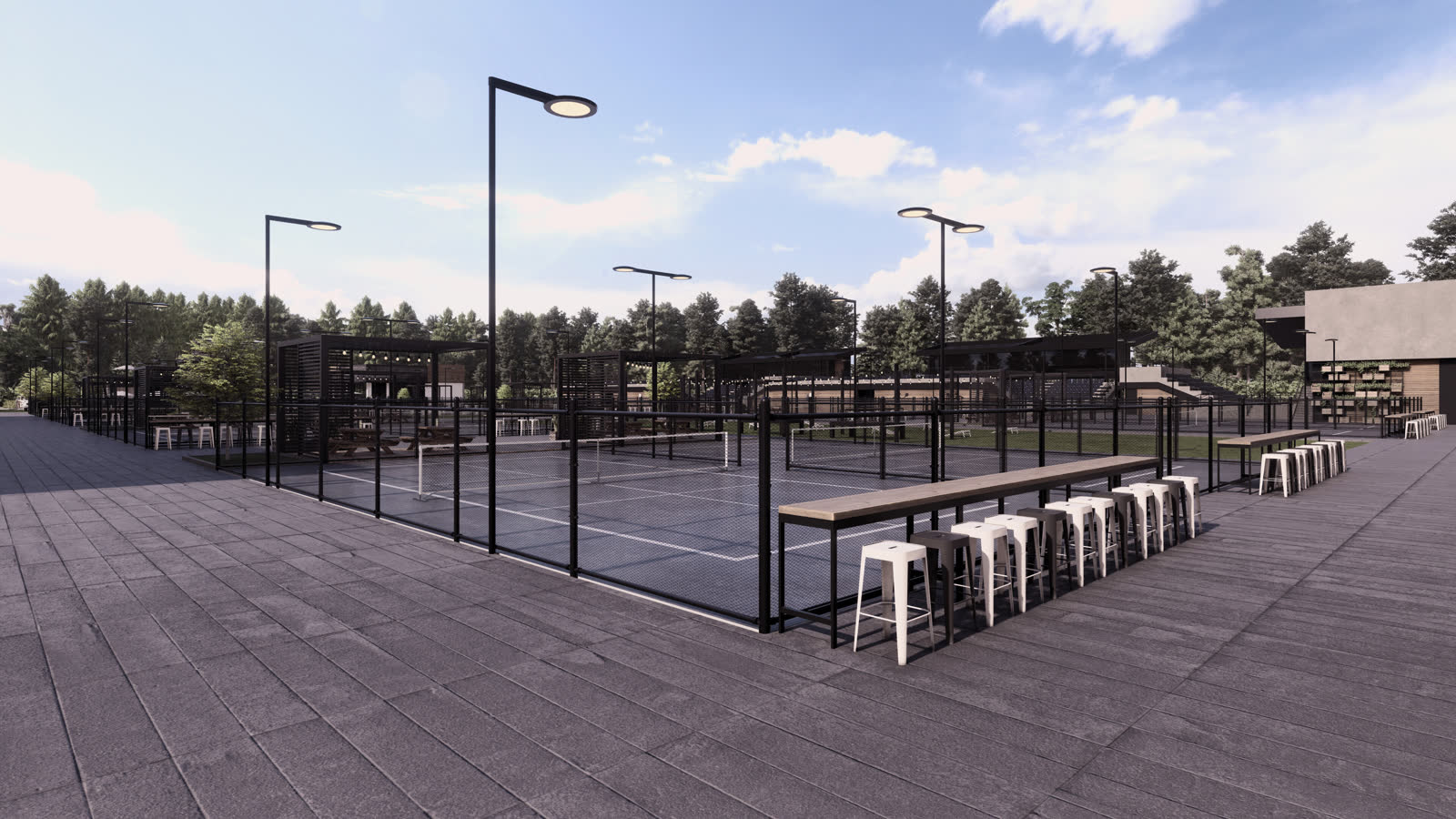 The outdoor courts under lights, the food hall glowing behind