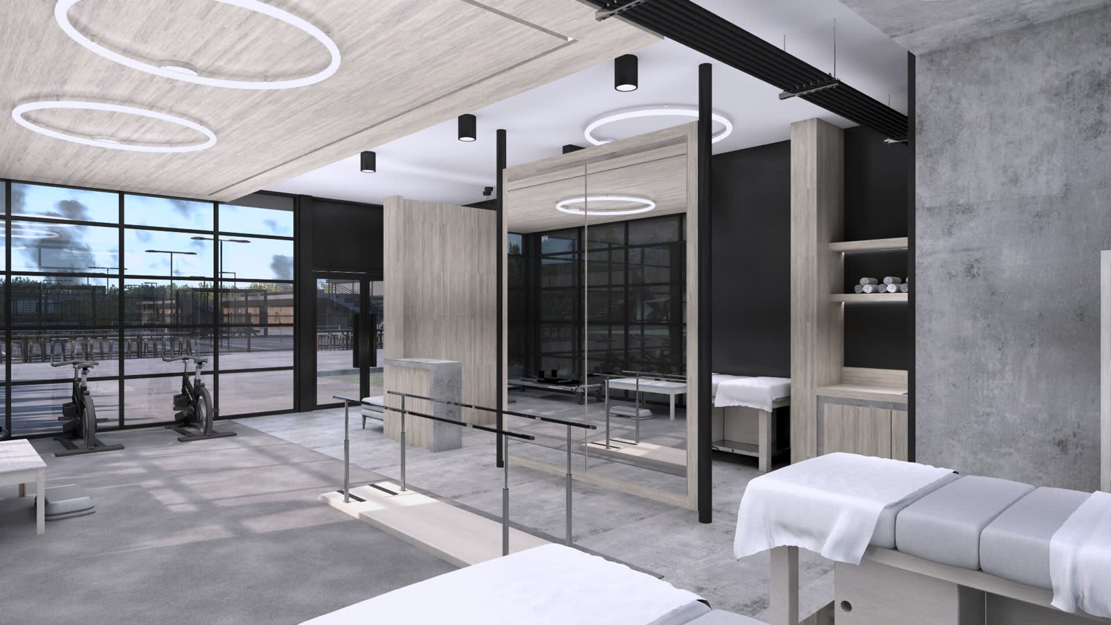 The therapy suite from the door, beds in a row under ring lights