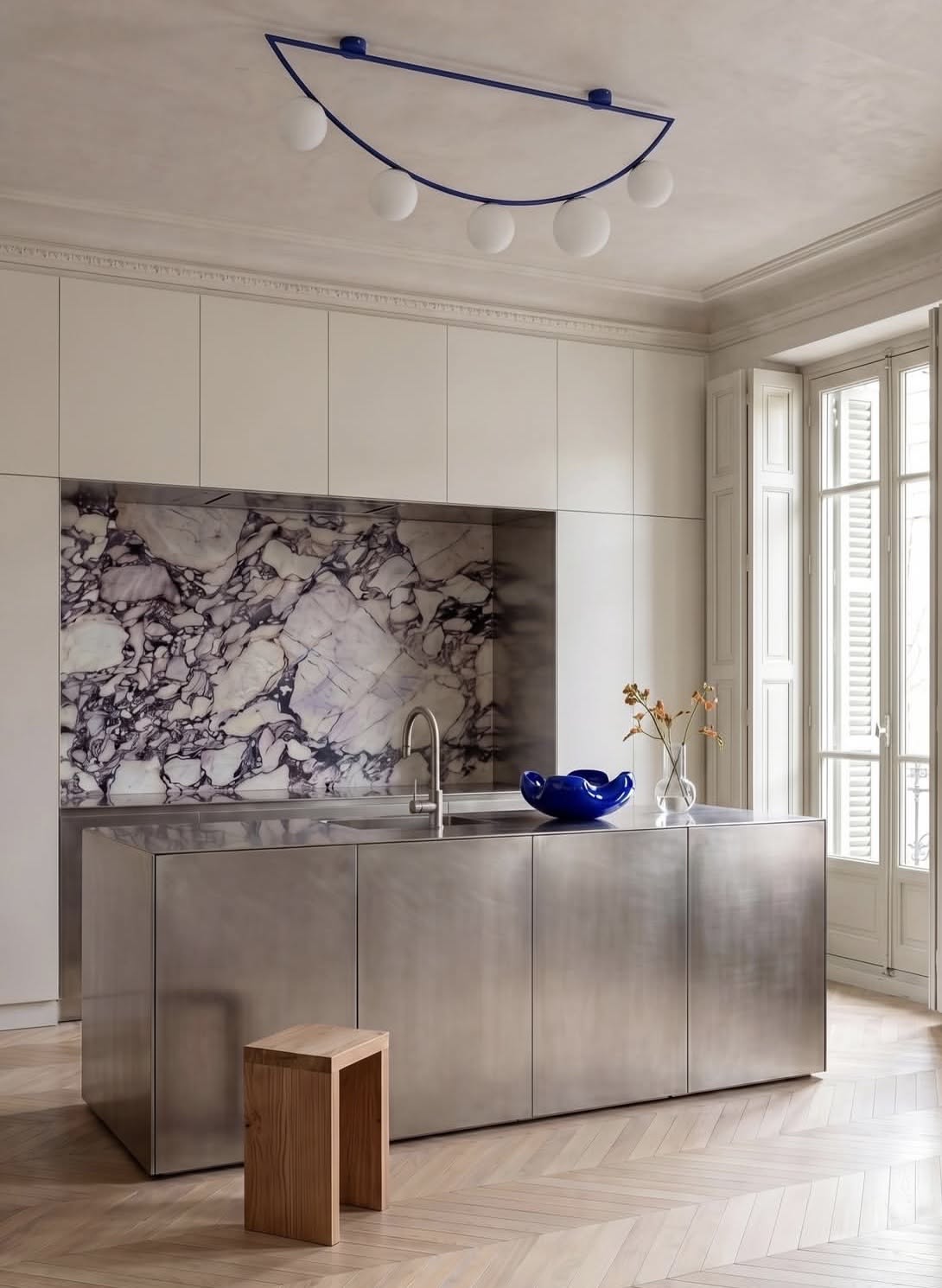 Kitchen, Marble splashback, steel island, cobalt vase, modern