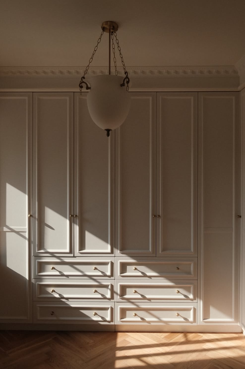 Foyer or stair, Cream panelled hall, glass pendant, calm