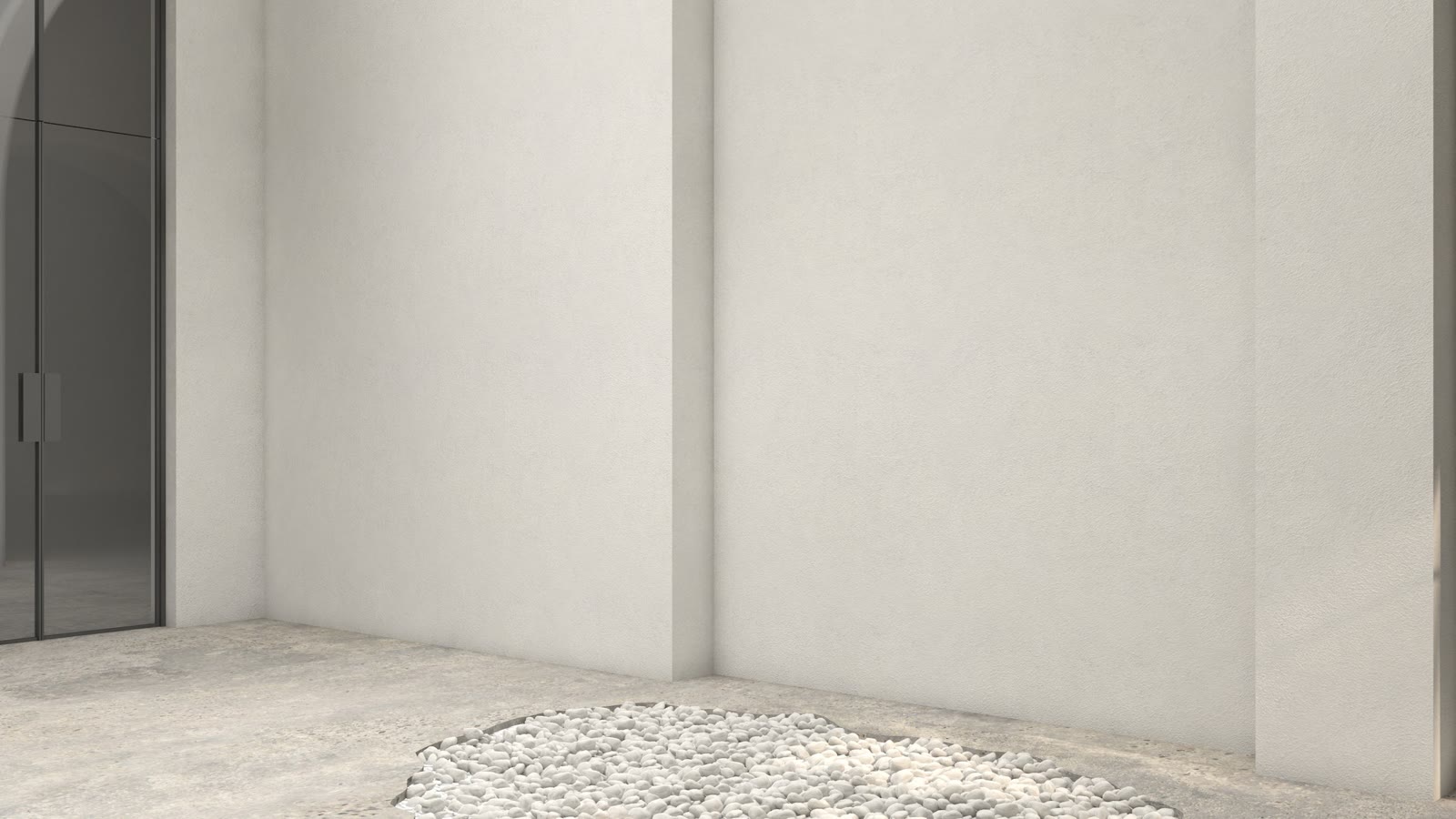 Bare bathroom shell: plaster walls, a gravel floor and no fittings
