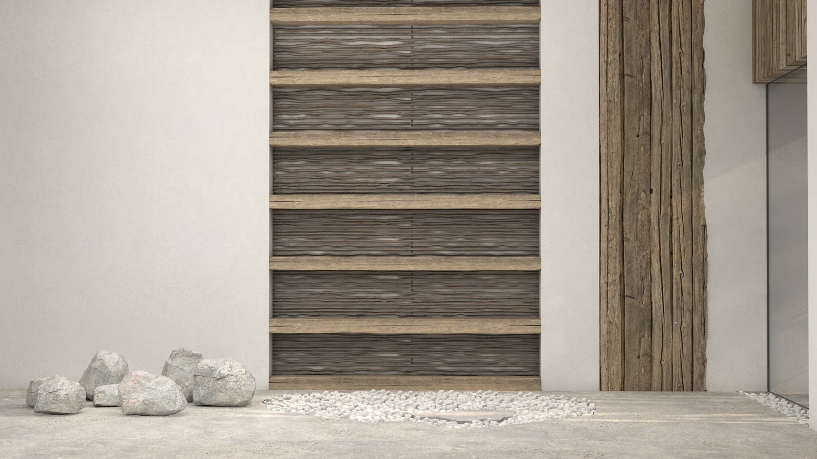 The slatted timber wall and river stones go in